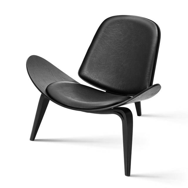 3-Legged Shell Lounge Chair in black with black vegan leather upholstery, inspired by Hans Wegner’s CH07 Shell Chair, showcasing a sleek and modern design.