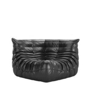 Corner piece of a modular seating arrangement in black vegan leather, PRO EDITION, inspired by modern design principles. Offers versatile configuration options for contemporary interiors.