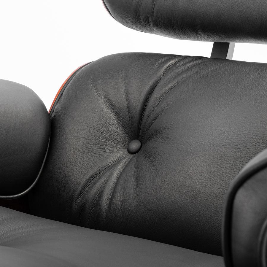 Close-up of the button tufting on the XL Tall Replica Eames Lounge Chair in rosewood and black leather, showcasing the meticulous detail and plush cushioning.