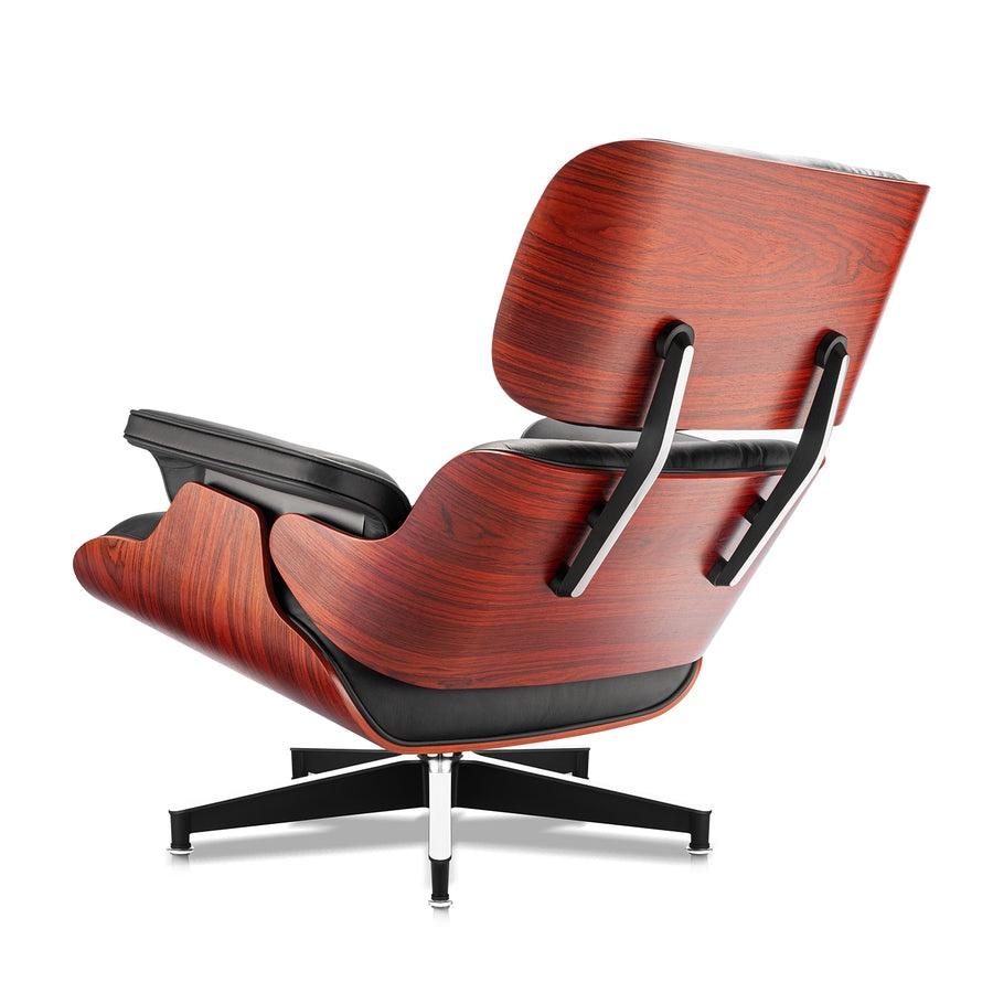 Back-angled view of the XL Tall Replica Eames Lounge Chair in rosewood and black leather, highlighting the chair's classic profile and craftsmanship.